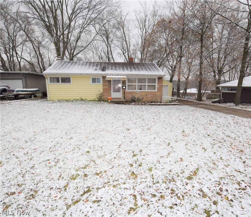 Welcome to 42 Highland Drive! This lovely 3-bedroom, 1-bathroom ranch located on a quiet dead end street in Tallmadge has numerous updates throughout. Spacious living room with large windows overlooking the front yard. Kitchen has beautiful new waterproof COREtec flooring (2019), new counter top and stainless steel sink (2019), and newer windows (2017). Bathroom was remodeled with new COREtec waterproof flooring, pedestal sink, toilet, tub, and surround (2019). Bathroom closet has shelves offering convenient storage space. Three nicely sized bedrooms painted neutral colors. Partially finished basement has large rec room with a brick fireplace, a large storage closet with shelves, a bonus room, and a storage area with washer and dryer. All interior doors are brand new. Carpet replaced in 2016. Backyard is fully fenced in with a wooden patio – perfect spot for relaxing outside. Detached one-car garage. Conveniently located 0.5 mile from the Tallmadge Circle. No worries as this one comes