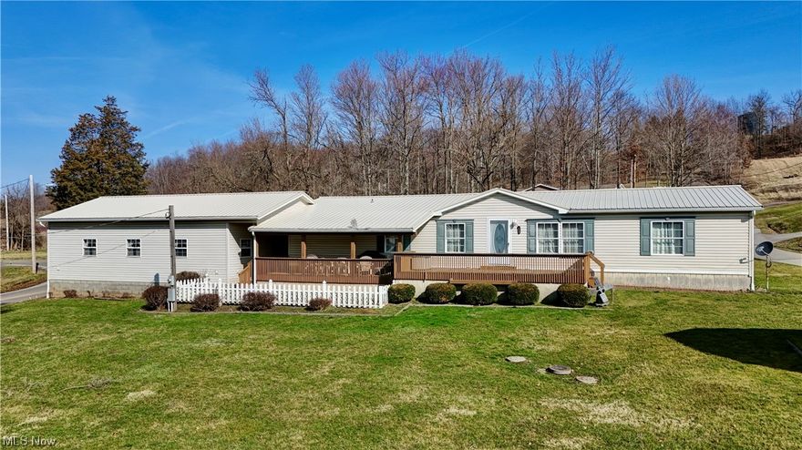 Located on 2 city lots, this property includes a doublewide with a 3 car attached garage as well as a front and back porch and a storage barn. Inside, there is a nice flow from the fully equipped eat-in kitchen with an island to the dining room and living room. The master bedroom has 2 good sized closets and a master bath with both a shower and a bathtub. Through the hallway, there are two additional bedrooms and a full bath with a shower. Finishing out the main floor, there is a sitting room and laundry room just off the breezeway from the garage. This property allows for you to enjoy plenty of evenings outside with the large front porch and flat front yard. Schedule a showing today to see this home!