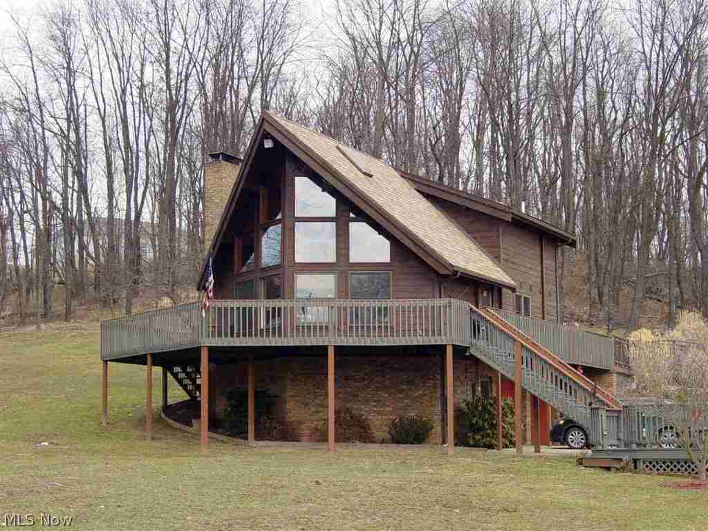 Peaceful serenity in this picturesque setting of this A-Frame home situated on 1.23 acres. Oak kitchen, vaulted ceiling, 2 car integral garage plus a 32 X 32 det. garage/workshop with finished office & 1/2 BA.