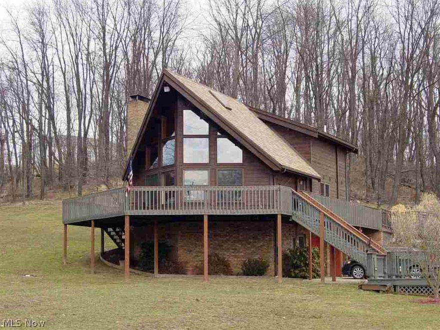 Peaceful serenity in this picturesque setting of this A-Frame home situated on 1.23 acres. Oak kitchen, vaulted ceiling, 2 car integral garage plus a 32 X 32 det. garage/workshop with finished office & 1/2 BA.