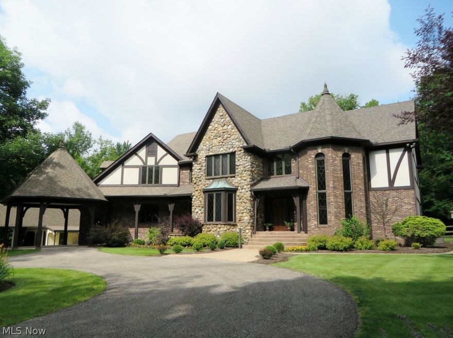 Don’t miss this spectacular private Kirtland Hills estate with stone walls, gated entry and circular driveway with portico that has been masterfully built by Metzger and offers living at its finest!  Enjoy entertaining in the stunning open designed grand 2-story great room with real stone fireplace and vaulted & beamed ceiling enhanced with a wall of windows, balcony, wide wood molding.  Chefs will delight in the gourmet kitchen with granite counter tops, Viking Range, walk in pantry and unique eating area with fireplace and a waterfall view.  Features marble floor foyer, winding staircase, formal dining room, and larger handsome library with fireplace and custom millwork.  Relax in the spacious master retreat with fireplace in private sitting room, balcony and huge his and hers walk in closet with newly finished glamour bath!  See highlight sheet for more information.