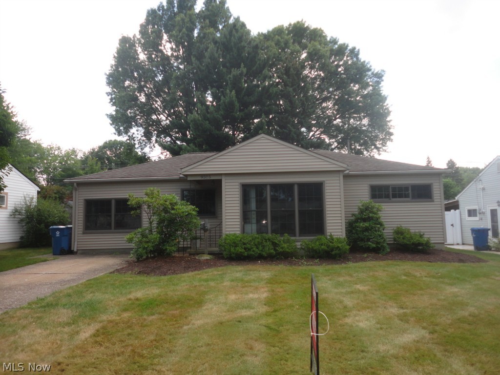 Parma Heights doll house ! Garage converted into a Family Room * Tons of newer windows for plenty of natural light * 3 new leaded glass exterior doors * Neutral vinyl siding * Newer three dimensional roof * Fenced yard and a shed * Laminate flooring in the Family Room * Updated Main Bath with ceramic tile and new tub * Newer carpet in the hall and Bedrooms * Newer Corian counter tops in the Kitchen with some updated stainless steel appliances * Updated 1/2 Bath * Cute covered patio to enjoy the beautiful yard with plenty of mature trees ! Must see this cute home !