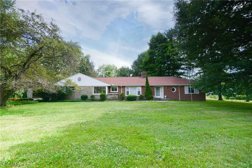 Location location location...nestled off a cul-de-sac, which is off another cut-de-sac, is this sprawling ranch with a full basement.  1.7 acres in Boardman with tons of privacy.    Roof is 5 yrs old.  New dishwasher, counter tops and kitchen floor all about 2 months old. Newer bathroom vanity and bathtub liner.  Neutral fresh paint.  Enclosed porch plus brick patio.  Pond drained and cleaned about 5 yrs ago.  Updated 200 amp breaker box. Additional shower in the basement.