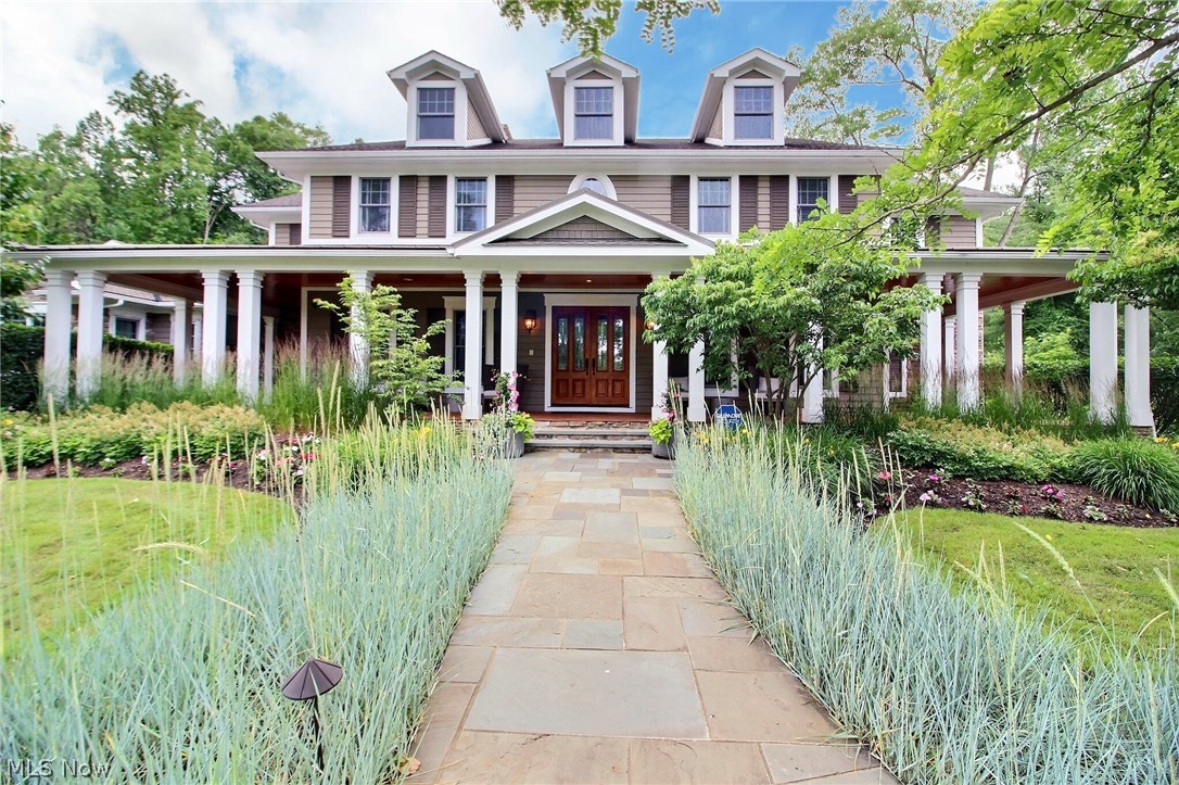 Up the long private driveway you will find yourself surrounded by the beautiful mature gardens. You will think you are in the pages of the Secret Garden while you are admiring the overflowing blooms and the sweet smelling flowers. The landscaping is truly magical. A wrap around porch will lead you inside this incredible home. Grand formal rooms throughout where every detail and space were thoughtfully designed. Great room with a two-story coffered ceiling and french doors to a large screened-in porch. A kitchen perfect for dinner parties and gourmet meals with an extensive workspace and equipped with top-of-the-line commercial appliances. Breakfast room and hearth room complete the kitchen ensemble. Sensational 1st floor master wing with a sitting room, french doors leading to a private porch, walk-in closet, luxurious master bath with a soaking tub, walk-in shower, and a fireplace. 2nd floor features 4 additional bedrooms, 3 full baths, a workout room, and doors to a porch overlooking