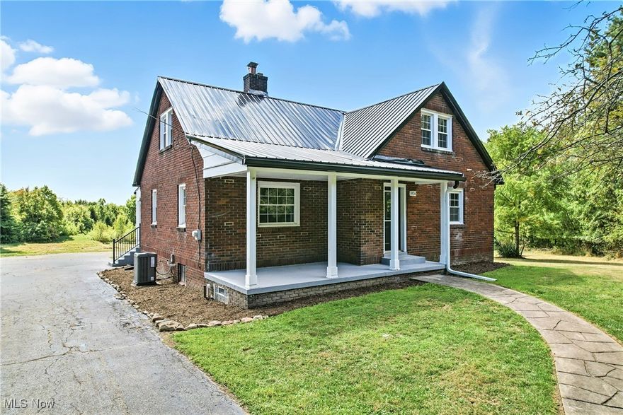 Welcome home to this beautiful brick & Vinyl Cape Cod styled home located on over 4.5+ acres. This expansive home features 2.5 baths and 4 bedrooms. Master bedroom suite on the  1st floor features hardwood flooring & and an on-suite tiled master bath. Livingroom features hardwood flooring & a floor to ceiling brick walled fireplace. Guest bedroom has hardwood flooring & would also make an ideal den or office area. All new tiled guest bath on the 1st floor. Large gourmet kitchen w/tremendous storage, new cabinetry, brass hardware, ceramic backsplash, new stainless appliances, & eating area. Dining room area would also make an ideal office, den, or T.V room. 2 massive upstairs bedrooms with new carpeting & storage galore. Large unfinished & high ceiling basement features a 1/2 bath and laundry area. 2 garages     ; 1st garage is 26 X 28 w/new garage doors and the 2nd garage is 12 X 18 w/new garage door. Updates include: New cabinetry, vanities, fixtures, appliances, roof, flooring, trim, furnace, central air, and much more. Rolling grounds w/beautiful views & vistas. Close to Sharon-Hermitage, Warren, Vienna, & Brookfield area. Vinyl replacement windows too. Also, to add to the ambiance, some of the original doors w/glass knobs have been kept.