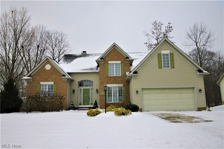 STUNNING UPDATED OPEN FLOOR PLAN, 1st floor Owner's Ste w/vaulted ceilings, cozy gas fireplace, 2 W-I closets & newer glam bath.  2 story foyer & Great Rm hosting a wet bar, gas fireplace wall & another wall of windows w/panoramic views of mother nature & a breath-taking wooded backdrop.  Formal Dining Rm off the kitchen w/natural light throughout glistens on the solid wood floor throughout the 1st floor. Updated Gourmet Kitchen w/granite counters, upscale stainless-steel appliances, glass back-splash & abundant cabinet & counter space, what is not to love. Newer French doors open to the spacious deck featuring drylock system w/convenient 1st floor laundry & large pantry off kitchen too. 3 Bedrooms up full bath & loft, a finished walk-out basement w/full bath and plenty of storage space too. List of updates available upon request. Don’t wait.