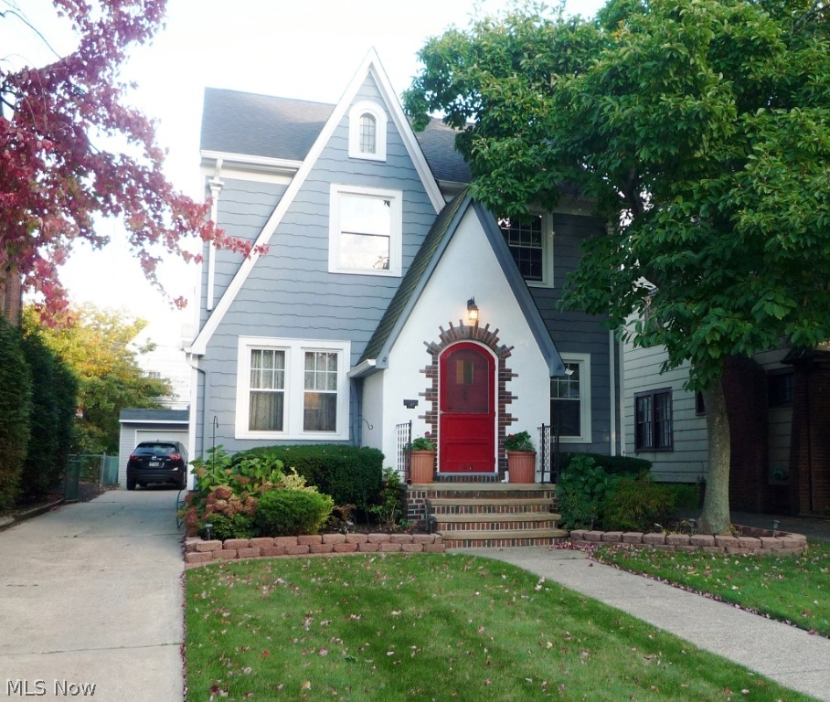 Picture-perfect 4BR, 1.5BA Colonial just North of Mayfield Road. Fabulous 4 year old custom Kitchen has breakfast bar, maple cabinets, built-in double oven, microwave & dishwasher, and new 3/4" hardwood floors! First floor features den/office, spacious Living Room with gas fireplace & leaded cabinets, & a large formal Dining Room all with glistening hardwood floors! Three Bedrooms, enclosed porch and a full bath are located on the second floor. The third floor is finished, carpeted and is the fourth Bedroom. Fun finished room in the lower level (Go Browns!). All electrical is updated. Brick patio, deck and Rubbermaid Shed in back of 2 car garage. Drive up and move in!
