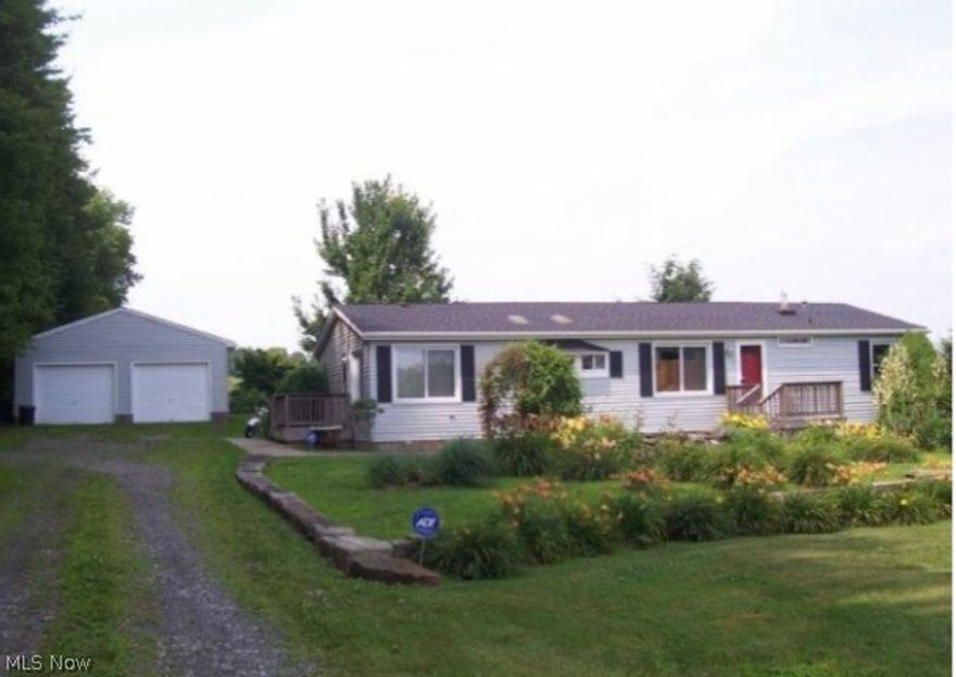 Beautiful manufactured ranch style home with additional outbuilding and greenhouse all on a little under 2 acres. Many upgrades including 220 in garage, above ground deluxe pool, decking around back of home and most upgraded appliances including washer and dryer.