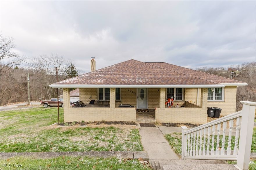 Charming brick home with an abundance of character in convenient location boasting over 3,000 sqft of finished living space. The home welcomes you with a covered and tiled front porch that takes you into a large, updated living room. From there you are taken into a dining room that flows into the large kitchen which has had many recent upgrades. Off the kitchen is a heated enclosed sun room that spans almost the whole length of the house with breath taking views of rolling forestry. On the main level there is also three nice sized bedrooms and an updated bath. The lower level is complexly finished basement featuring a second kitchen, bar, rec room, storage, office space, work space, laundry room, and a second updated full bath. Outside features a nice yard with fire pit, newer retaining walls in front yard.