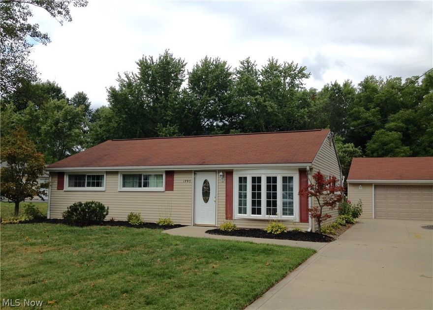 Gorgeous open floor plan ranch that has been completely updated, interior and exterior. Enjoy cooking in your chef's Kitchen with stainless steel appliances, center island, newer counter tops, tile back splash and ceramic tile floor. The open and bright Living Room offers a sunny bay window with laminate wood floors and adjoins your Dining Room. The windows, siding and roof are newer and the home has been completely re-insulated for maximum heating and cooling efficiency. The Family Room has newer carpeting, skylight and a sliding glass door that opens to the large, fenced in, nicely landscaped backyard and patio. Master Bedroom and two additional Bedrooms offer newer carpeting. Neutral decor through out.  This home also has an extra wide newer concrete drive that leads to a 2 car garage with garage door opener.  Professionally landscaped, this home is ready for you to move right in!!