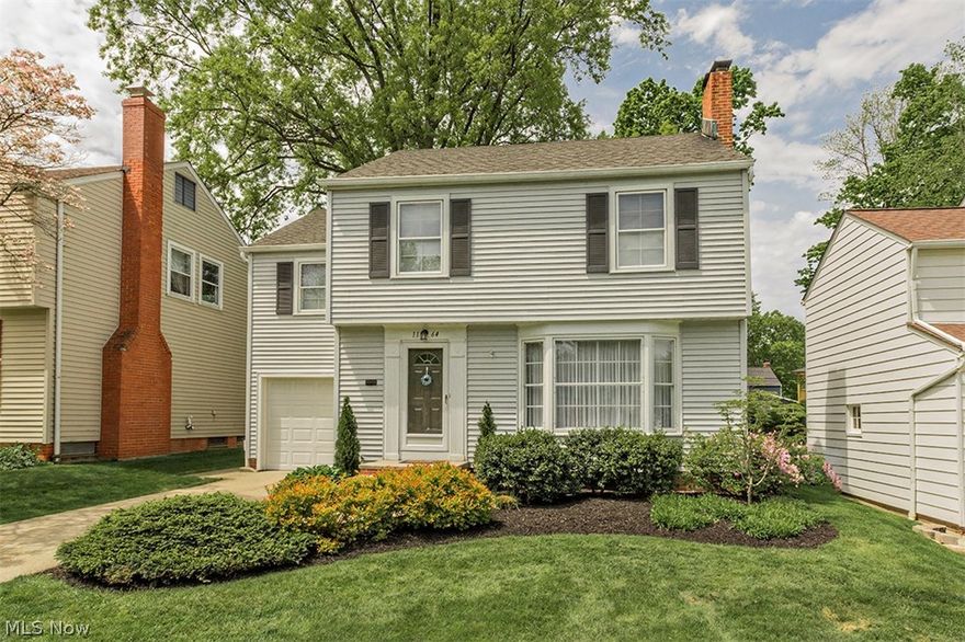 Well-maintained vinyl sided colonial on one of Lyndhurst's most desirable streets! Large living room has bay window affording plenty of light, hardwood floors and wood burning fireplace surrounded by shelves and cabinets. Dining room has hardwood floors and door leading to ample sized deck for summer enjoyment. Plenty of cabinets in kitchen with ceramic tile floor. Knotty pine, paneled recreation room in basement.