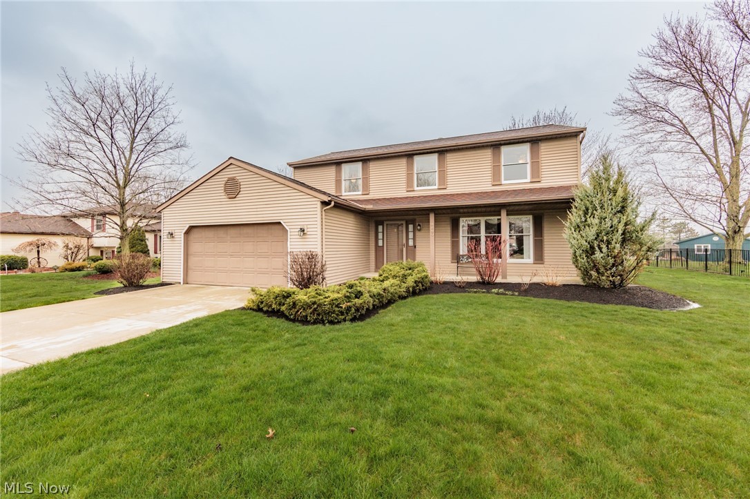Welcoming 4-bedroom, 2.5-bath Colonial nestled in Strongsville's Huntington Park Estates Community. From its charming curb appeal to its lush landscaping and covered front porch, this home exudes an inviting atmosphere from the moment you arrive. Step inside to discover a foyer that opens up to a bright and inviting living room adorned with crown molding, seamlessly flowing into the formal dining room, creating an ideal space for entertaining guests. The eat-in kitchen boasts ample wood cabinetry, generous prep space, included appliances with a newer dishwasher(2019), and a dining area perfect for casual meals. The family room is a cozy retreat featuring a beamed ceiling, a brick, gas fireplace with built-ins, 65” Samsung 4K TV and a slider leading out to the covered patio and a generously sized backyard, perfect for outdoor gatherings and relaxation. A convenient laundry room with a utility tub and newer washer & dryer (2017) along with a convenient 1/2 bath complete the main level. Upstairs, retreat to the spacious owner's suite offering ample closet space and a private bath for added comfort and privacy. Three more comfortable bedrooms and a second full bath with a double sink vanity round out the upstairs living quarters. Additional living space awaits in the finished basement, featuring a large recreation room, a bonus room ideal for a private office, and a utility area with storage. Notable updates include a dehumidifier(2024), furnace and A/C(2014), Aprilaire humidifier(2019), and water heater(2018). Modern conveniences such as a Ring doorbell, Ring spotlight in the back, and smart WiFi garage door. Community park, playground, pool, and tennis courts to enjoy. Conveniently located near shopping, Metroparks, the turnpike, and I-71. This home offers the perfect blend of comfort, convenience, and community. Welcome Home!