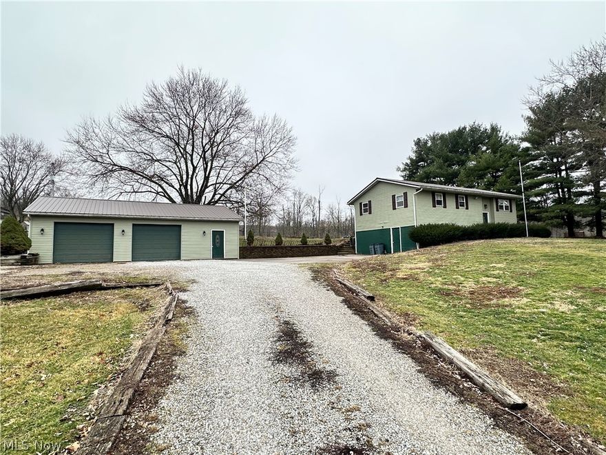 Welcome to this well-maintained split-level home situated on nearly one acre in Union Township, within the East Muskingum Local School District. Built in 1978, this property offers approximately 2,016 square feet of finished living space, featuring 3 bedrooms and 1.5 baths with a functional layout that provides separation of living areas while maintaining an open, comfortable feel.
Major exterior improvements have been completed within the past two years, including a new metal roof on both the home and the 32x40 detached garage, along with new vinyl siding, offering long-term durability and low-maintenance ownership. The home is heated by an electric ceiling coil system, with cooling provided by a ductless mini-split unit, allowing for efficient, zoned comfort.
The lower level includes a partially finished, walk-out basement that provides additional living space and houses the laundry area. Public water and private septic service the home. Outside, the 0.99-acre lot offers a peaceful rural setting with ample room to enjoy the outdoors.
A standout feature of the property is the 32x40 detached garage, ideal for multiple vehicles, storage, or workshop use, along with a 12x24 shed providing additional storage. Conveniently located while still offering privacy, this property presents an excellent opportunity for buyers seeking space, recent upgrades, and versatile outbuildings.
Property is being sold AS IS.