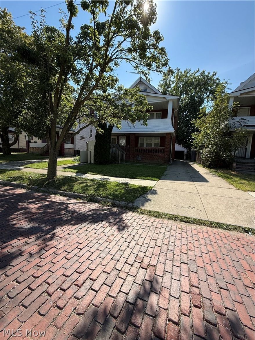 Discover an incredible opportunity with this well-maintained brick two-family home in Cleveland's South Collingwood neighborhood. Perfect for an owner-occupant looking to generate income or a savvy investor seeking a solid addition to their portfolio. Each unit features a classic layout, separate entrances, and a full basement. Situated on a quiet brick street with a nice backyard and a two-car garage. This property is close to schools, public transportation, and has convenient highway access, making it a desirable location for tenants. Don't miss this chance to own a piece of a neighborhood on the rise. There is a permanent voucher tenant on the first floor and individual room rentals on the second floor third floor is unfinished, leaving a value ad opportunity for the next owner.!