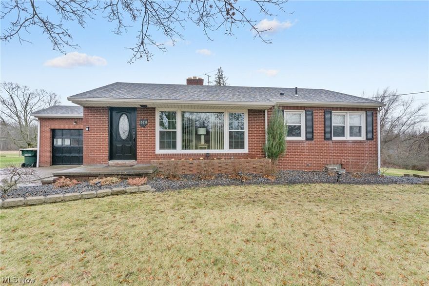 Welcome HOME to this charming, completely updated three-bedroom, one-bath brick ranch home in South Range Schools.  All it needs is YOU!  This gorgeous property features a modern and welcoming interior, with a spacious living room that boasts tons of natural light with all the large picture windows that have been updated. The kitchen has been completely renovated with new stainless steel appliances, gorgeous countertops, a ceramic tile floor, and ample cabinet space with a full pantry. Each of the three bedrooms are cozy with comfortable living space.  Currently, the third bedroom is being used as an office.  The home has all brand-new luxury laminate flooring throughout. The updated bathroom has been updated as well with a walk-in tile shower. Outside, the home sits on over 1.7 acres with well-maintained landscaping. The backyard provides privacy, a lovely outdoor space for relaxation on the covered cement patio, and plenty of yard for the animals to run.