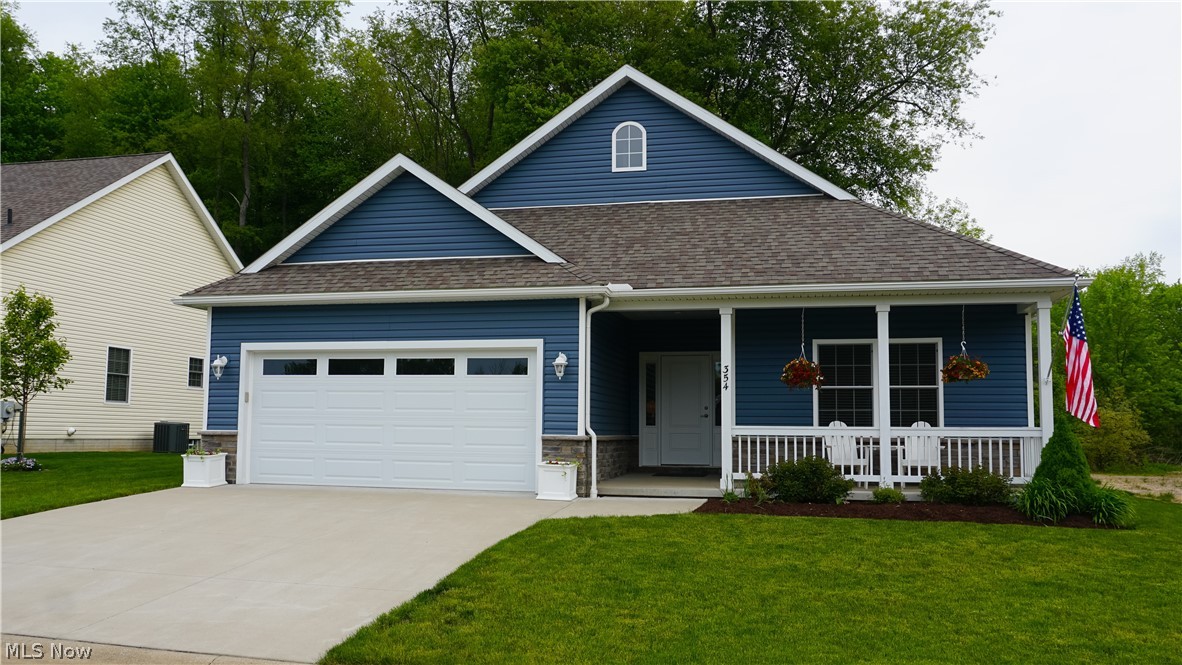 This is a pet free, non-smoking home. Gracious living all on one level! 3 bed, 2 bath slab home located in the desirable Fulton Landings Development. There is a 2-car attached garage with hot and cold-water spigots. Want to leave the car at home? A short walk or bike ride on the nearby Towpath to downtown Canal Fulton, offering restaurants, shopping and great ice cream shops, may be just your thing. The front covered porch flanked w/ a white railing allows a beautiful place to relax or chat with neighbors passing by. Through the front door you will be welcomed by the extra-large foyer that flows into the great room which boasts 12-foot ceilings. The large beautiful windows surrounding the gas fireplace allow plenty of natural light to flood the room. The mounted TV is included w/ the sale. The eat in kitchen has plenty of space for cooking and entertaining. There is a mud/laundry room and through the sliding door is an upgraded concrete patio that backs up to a wooded area allowing