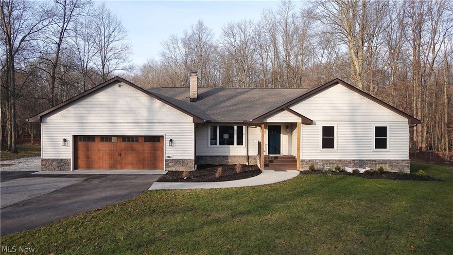 Completely Renovated and Rebuilt 4 Bedroom, 3.5 Bath Ranch Home in a country setting of 1.5 acres. Just the right size, this beautiful new home offers charm along with modern living, the perfect blend of comfort, convenience, and natural beauty. First floor living at it's best, the huge kitchen features soft close cabinetry, new appliances, gas stove w/exterior ventilation, quartz counters, glass backsplash, a 9' island with seating, tons of storage, and a walk-in pantry. The adjoining dining area is large enough to seat 8 to 12 if you like. Walk out to a spacious deck and lower patio for all the outdoor enjoyment. Vaulted ceilings, skylights, recessed lighting through out this home along with so many windows providing natural light. A main floor laundry and half bath are off the 30' garage with 18' garage door, which also has hot and cold water. Close the door on that area if desired, and enjoy the beautiful Living Room. 2 Bedrooms and a gorgeous bath with soaker tub are down one hall which also has multiple closets, while the light filled Master Suite features a walk in closet and a simply stunning Master Bath. The Bath, with it's wall of closets, may also serve as a dressing room. Downstairs the full basement is finished as a large family room with wood burning fireplace, and a large Bedroom Suite with egress window and Full Bath. A 2nd laundry is set up for the use of the downstairs. A detached garage features both front and back garage doors. Additional shed in partially fenced yard. Back yard is wooded with a stream crossing the property. Everything in this home is new - the only pieces from the original home are the subfloors and some wall studs! Located between Aurora and Chagrin Falls in the award winning Kenston Schools. Be sure to watch the Virtual Tour and Welcome to this beautiful lifestyle home! Agent owned