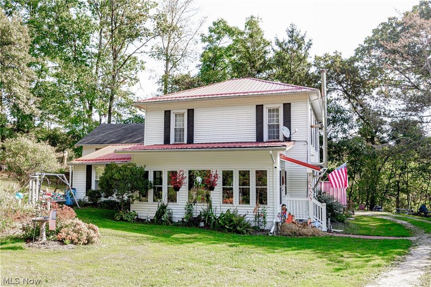 Historic Home in the Village of Hanover, Park Like Setting. Very Secluded yet minutes to St. Rt 16. Located Licking Valley School District, 3 acres, Bike path within walking distance, recent updates include Metal Roof, Vinyl Replacement Windows, newly remodeled Primary Bath, Beautiful Enclosed Four Seasons Sunroom, Newer Furnace, Central Air, Hot Water Tank, New Septic Tank and Leach Bed, & Woodburner, also Like New Generator. Natural Gas Heat. Homesteading very possible here. Large Garden Area, fenced in Pasture, and Chicken Coop for your own Mini Farm. Wonderful Opportunity to own your little piece of paradise