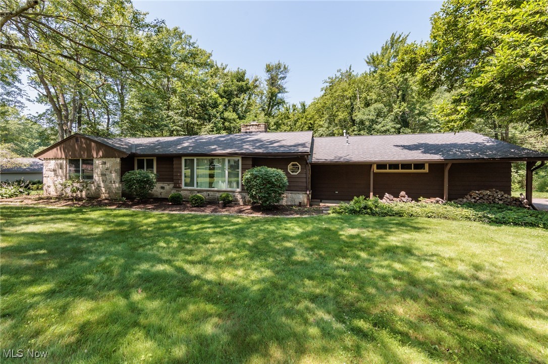 Welcome home to this charming three-bedroom, two-bathroom ranch nestled on just over 1.5 acres of scenic land. The spacious living room, highlighted by a beautiful stone fireplace, flows seamlessly into the dining area—perfect for both everyday living and entertaining. The warm, inviting kitchen offers ample cabinet space and overlooks the serene, tree-lined backyard. Step outside onto the wood deck to enjoy peaceful views and nature’s beauty. Additional features include a two-car attached garage and a well-maintained, private lot offering plenty of outdoor space. A perfect blend of comfort, space, and tranquility!
