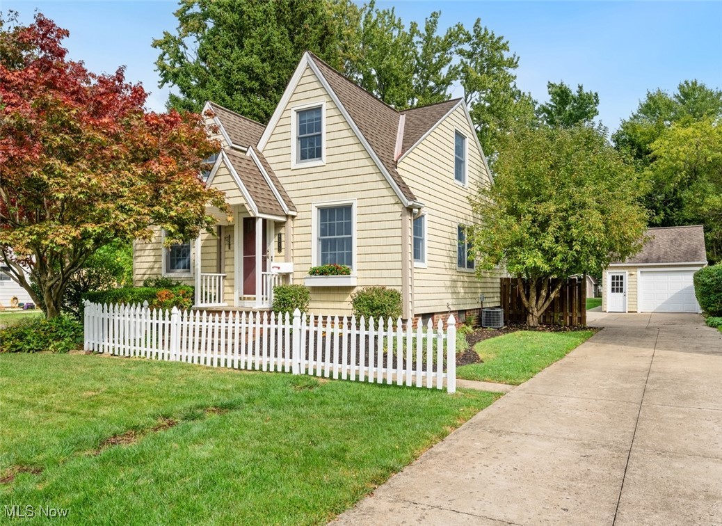 WOW! Welcome to your New Home—a delightful Cape Cod brimming with upgrades! The vinyl shaker-style siding, inviting front entrance & classic white picket fence create an irresistible curb appeal. Gorgeous refinished hardwood floors flow seamlessly through the entire 1st floor. Ideal open floor plan between the kitchen, dining room & living room. Classic white cabinetry w/brand new sink & countertop, subway tile backsplash + newer, high end, stainless steel appliances including a gas range w/convection double oven & pot-rack. Two bedrooms on the 1st floor, one with built-in shelving & the other w/double closets. Updated 1st floor bathroom boasts timeless tile flooring, a classic subway tile shower, and elegant faucets. The 4-season sun-room w/newer vinyl windows (2018), tile flooring & heater is the perfect place to relax and enjoy views of the back yard! Upstairs is the primary suite w/newer carpet, skylights, vaulted ceilings, tons of storage w/multiple closets (4) including a walk-in & an updated full bath with a gorgeous tile shower & skylight, sink vanity & makeup vanity + lots of storage. The basement is finished w/ceramic flooring, recessed lighting & has a nice laundry room w/ great counter space & storage space, a half bath & a nice size rec room w/electric heat & decorative fireplace. Outside is the 1-car garage, w/a loft for storage + an attached workshop or office w/heater + indoor/outdoor speakers. Situated on a stunning, spacious lot—almost 1/3 of an acre! Imagine yourself savoring the outdoors on the charming 200 sq.ft. deck adorned w/ a pergola, surrounded by the soothing sounds of music & nature. Other updates include: Furnace replaced 2022. New toilets 2022. Back flow valve replaced 2022. Sump pump w/backup battery. A gorgeous home full of character & charm & modern updates, ready for its new owner, in desirable Fairview Park! Awesome location w/quick access to shopping on Lorain or Westgate Mall, Metro Parks and both I-90 & I-480. A must see!