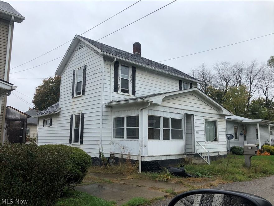 2 story home in need of some TLC.  Large rooms.  Dining room with lots of windows.  Large 2 car detached garage.