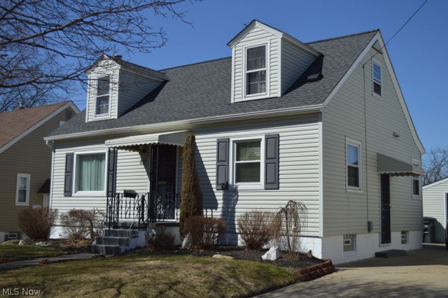 Absolutely "move in ready" !!!  This three bedroom Cape offers newer windows on main floor, roof, siding and gutters, carpeting, updated bathroom and an eat-in kitchen with remodeled cabinets, countertops and laminate flooring.   Two bedrooms on the first floor and an oversized, 30x13 bedroom on the 2nd floor.   The lower level has been very well finished with  pyramid style ceiling tiles, an elec fireplace (with heat), glass block window (with vents), built in cabinet for small frig and an unfinished side with plenty of storage and very clean laundry area.  The furnace is estimated to be 10-12 years old, the newer windows 6-7 years and the roof, siding and gutters in 2007.  Home is wired for ADT.   Nice size back yard and large deck and an oversized 1 car garage.
This one is very affordable, well maintained and very nicely decorated.