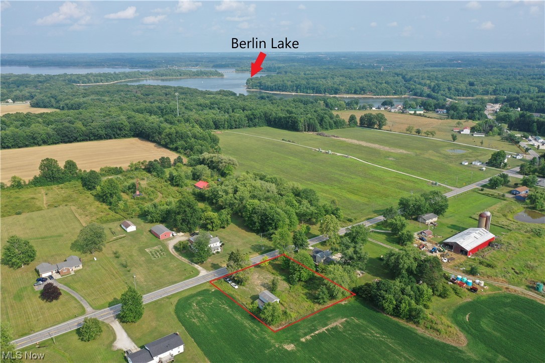 WOW! Berlin Reservoir is just around the corner from this 0.669 acre clear level lot. Aerial pictures show how close the lake is to this lot. Lot features a 5-6 car garage with second floor loft built in 2008. Garage is 32X24. Garage is a great place to store cars, or a boat, and the second floor would make a great storage, or workshop area. There used to be a house on this lot. The house was removed, and the well and septic have been abandoned. Portage County Building Department and Portage County Health District (Ohio Administrative Code) guidelines are applicable to the use of this property. Recreational vehicles, campers, or the garage, are not permitted to be used as a dwelling. Convenient location to Berlin Reservoir, winery, golf, restaurants, & Routes 14, 225, 224, & 183.
Buyer is responsible for property information contain herein and property suitability for buyers intended purpose.