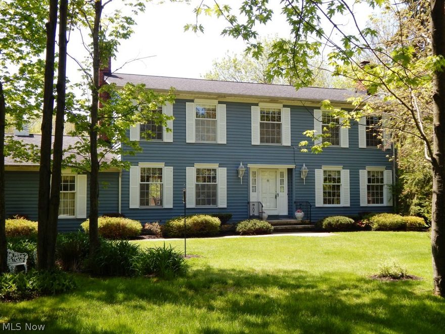 Pristine Kirtland Colonial on 2.17 acres boasts five large bedrooms, 2.5 baths, 3 car side entry heated garage and finished basement with a wet bar and ample storage. The updated kitchen features all white Thomasville cabinets with stunning granite countertops, ceramic tile back splash, oak hardwood floors and an Anderson slider that leads to the 25x16 Trex deck. There are two w/b fireplaces, one in the family room, one in the living room and the formal dining room is elegant & spacious with white paneling and a bay window inviting plenty of natural light. For the hobbyist, the 42x24 Pole Barn will easily accommodate 6 more vehicles and is equipped with electricity and floor drain. This home shows pride of ownership throughout with fresh paint in many areas, a security system and all appliances stay! Seller also providing a One Year Home Warranty, this one won't last!