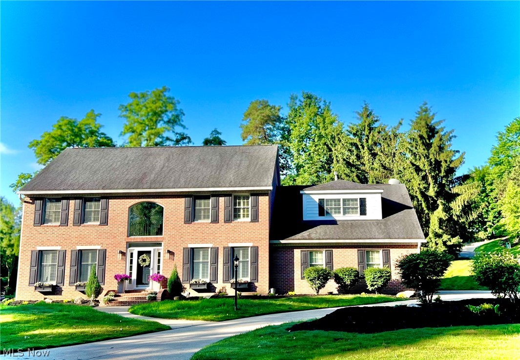 Stunning and stylish with an all new open floor plan and new custom kitchen with quartz counters, 9 ft center island, abundance of custom cabinetry, stainless steel appliances, quality fixtures, pot-filler at stove and more. New look, new updates, and new landscape...this home is not what it once was! Welcoming entry with two story foyer, turned staircase and gorgeous hardwood and ceramic tile floors throughout. This stately brick colonial is situated on nearly half an acre with a private backyard, 3 car garage, circular driveway and within walking distance to the Glenmoor club house. Freshly painted interior, 1st floor laundry, super spacious room sizes and neutral decor'. The family room offers a classic look fireplace surrounded by a custom wood mantel with black and gold accents. Living and dining rooms are simply beautiful and inviting for all your entertaining needs. Exceptional 2nd floor with gorgeous hardwood floors in all 4 bedrooms, oversized master suite with fireplace, connecting bonus room (ideal for private office or workout area), extra storage and walk-in closets, full bath with jetted tub, shower and plantation style blinds throughout. You will love the finished lower level with great lighting from multiple egress windows, wet bar, fireplace, full bath and loads of storage. This is a great home in a great location and price...call today!