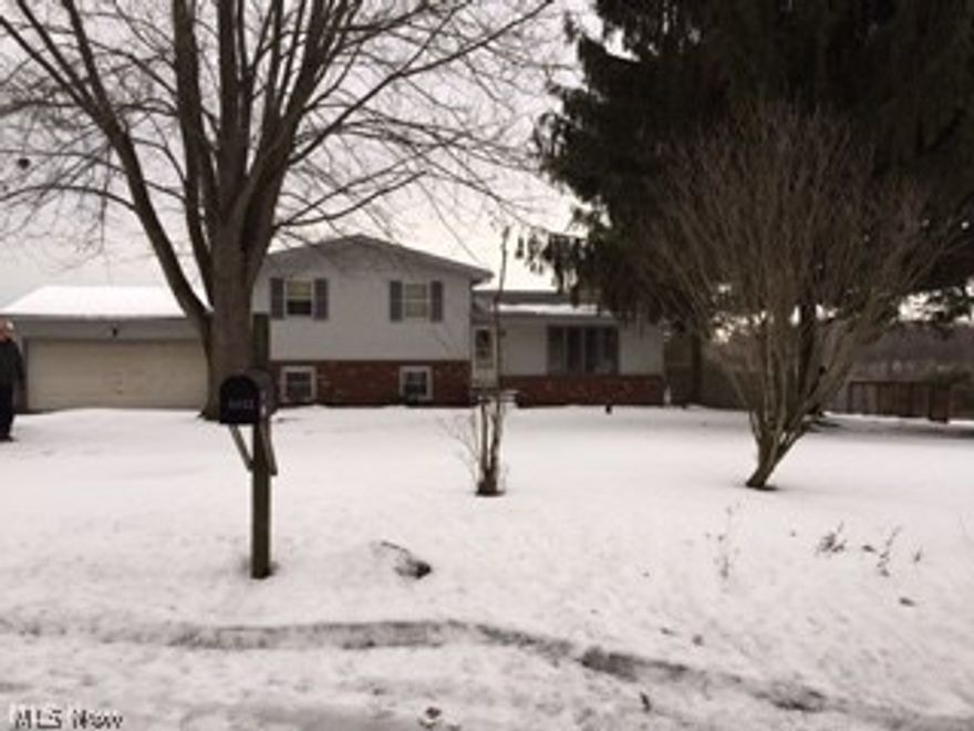 3 bedroom, multi-level with 2 car attached garage.  Rear deck for country living on .85 acre.  Outbuilding included.