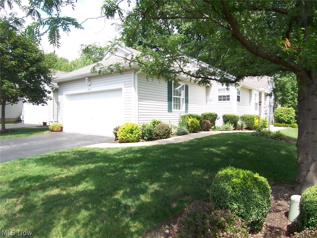 Wow - this fabulous condo is located at popular Woodbury! This is one-floor living at it's best. This exceptional condo has been updated in every room. The fully applianced kitchen has newer upgraded stainless appliances, Silestone counters and glass accented backsplash, newer sink/disposal/touchless faucet, and under cabinet lighting. There is newer upgraded carpet (2013) on the first floor in the LR, DR, and both bedrooms, and on the lower level in all finished areas (2015). Lower level family room has built-in KraftMaid cabinets for the entertainment center, desk and bar. You will also find the 3rd bedroom (w/walk-in closet), and another full bath, as well as two office areas on the LL. The 1st fl laundry has white upper and lower cabinets, granite countertops & under cabinet lighting. Both baths on 1st fl have been completely updated to include tile shower/bathtub, granite countertops, new sink & faucets, tile flooring, commodes & lighting. All bi-fold doors on the 1st floor have b