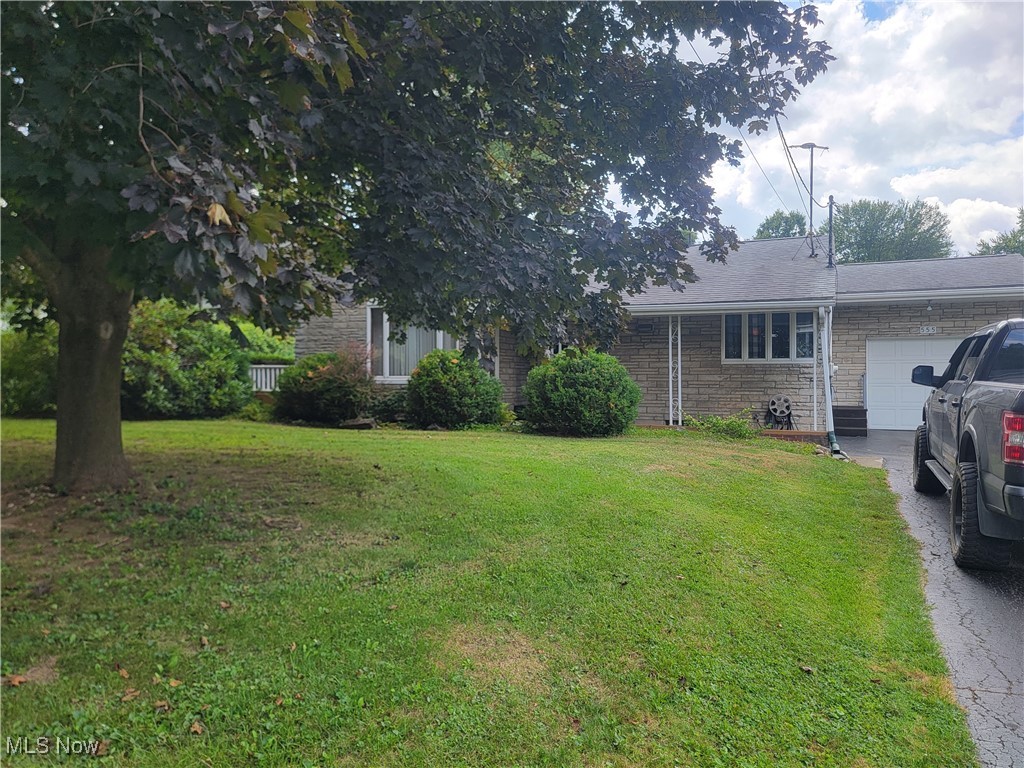Schedule a showing for this property today! This stone ranch style home features a beautiful eat-in kitchen with lots of cabinet space, hardwood floors throughout, some with carpet over. A partitioned room in basement for a craft or hobby room. Basement includes a full bathroom as well as an extra room under the garage for additional storage. This home also features an outdoor patio area for room to entertain and a fenced in back yard for your beloved pets. All appliances stay with this exceptionally clean property making it truly move in ready.