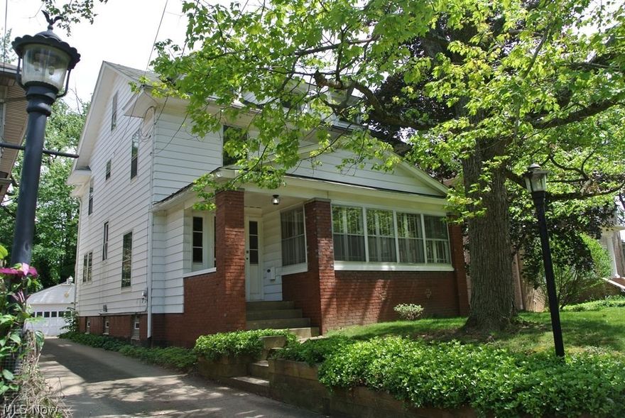 Lots of expensive and major updates in last few years. New high efficient furnace and central air, new hot water tank, copper plumbing, glass block windows. Best of all is the new white kitchen with farmers sink, granite counters, stainless steel appliances, breakfast bar and eating area. The original pine floors have been refinished. Handy half bath to kitchen and rear entry. Formal living and dining rooms have natural oak floors, oak trim and wide oak crown molding. Dr has large bay window on the south side. Lr has wood burning fireplace flanked by bookcases with glass doors. The original front porch has been enclosed for additional space. The foyer entry features an oak bench and sidelights next to the entry door. Upstairs the master bedroom has an artificial fireplace. All bedrooms have pine floors with one refinished to show the potential. Bathroom floor was updated at some point and vitrolite remains around the tub. There are two adjoining rooms at the rear, one of which is an up