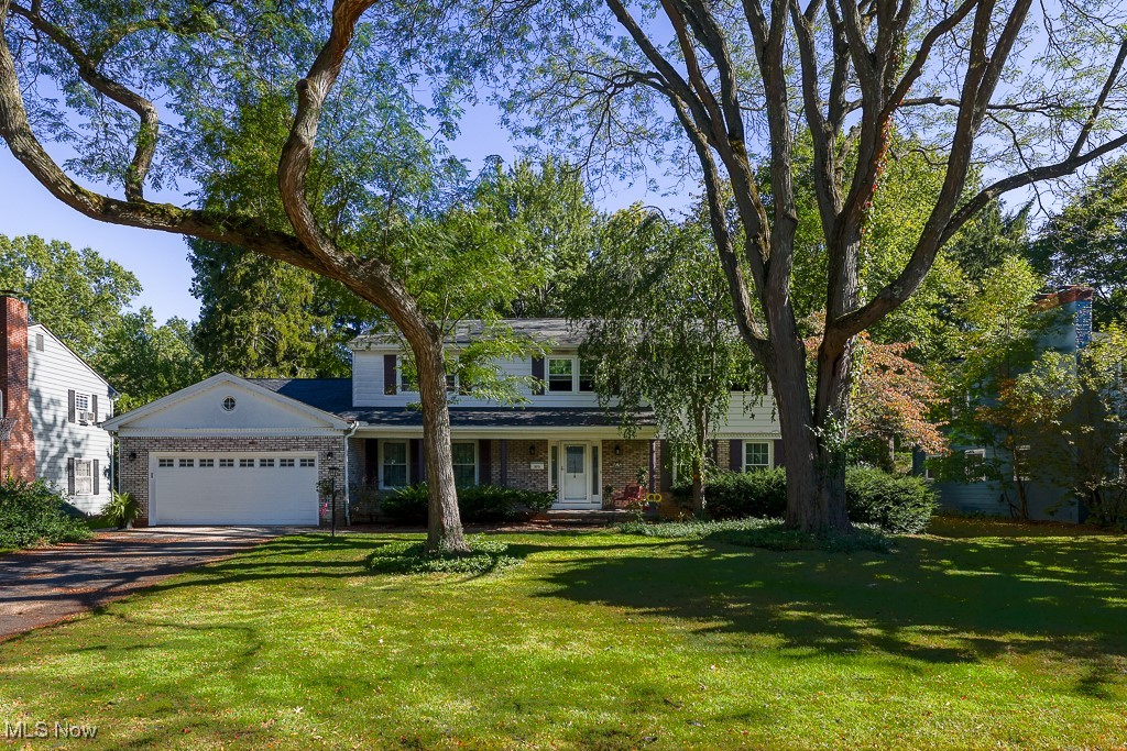 Welcome to 373 Tremont Road — Step inside to a spacious entryway featuring classic Terrazzo tile that opens into a warm and inviting living room featuring one of the first floor fireplaces. A formal dining room offers the perfect setting for gatherings, while the large den provides a comfortable second living area with built-in bookshelves, a second fireplace, and sliding doors leading to the shaded backyard—an ideal spot to unwind or entertain.
The kitchen is both functional and stylish, featuring granite countertops, a double oven, and abundant storage, making it easy to handle everything from weeknight dinners to holiday meals. A convenient first-floor laundry and two half baths add everyday practicality. Upstairs, you’ll find three generous bedrooms plus a spacious primary suite filled with natural light. The primary suite includes wood floors, a private dressing room with built-in cabinetry, and an ensuite bath with tile floors.
The lower level offers a waterproofed basement with two sump pumps and plenty of potential for future living space, a workshop, or home gym. Set in a quiet, well-kept neighborhood near Fairlawn Country Club and minutes from Fairlawn and downtown Akron, this home combines character, comfort, and functionality—ready to welcome its next owners. Major recent upgrades include a new roof in 2020. New windows throughout (except kitchen) in 2025. New gutters and downspouts in 2024.