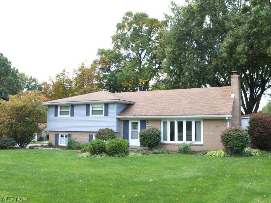 Amazing find! Fantastic outdoor entertainment space, 3-car attached garage and finished lower level! 3 bedroom, 1.5 bath split level in Plain Township. Spacious formal living room has a bay window, built-ins and a gas fireplace. Wonderful eat-in kitchen has a countertop range, wall oven, dishwasher, refrigerator, dinette with slider to back deck and is open to the formal dining room. Convenient half bath on the main level, too! The master bedroom has direct access to the full bath with solid surface countertop, soaking tub, separate shower and linen closet. There are 2 additional generously sized bedrooms - 1 with hardwood flooring. Walk up attic space allows for fantastic storage! Finished lower level has a rec room with a fireplace, a bonus room and a large storage room. The fenced-in backyard has a glorious outdoor entertainment area offering a huge deck that has a 17x14 covered portion with cable hookup and entertainment center! Wonderful for hosting gatherings! Bonus whole house g