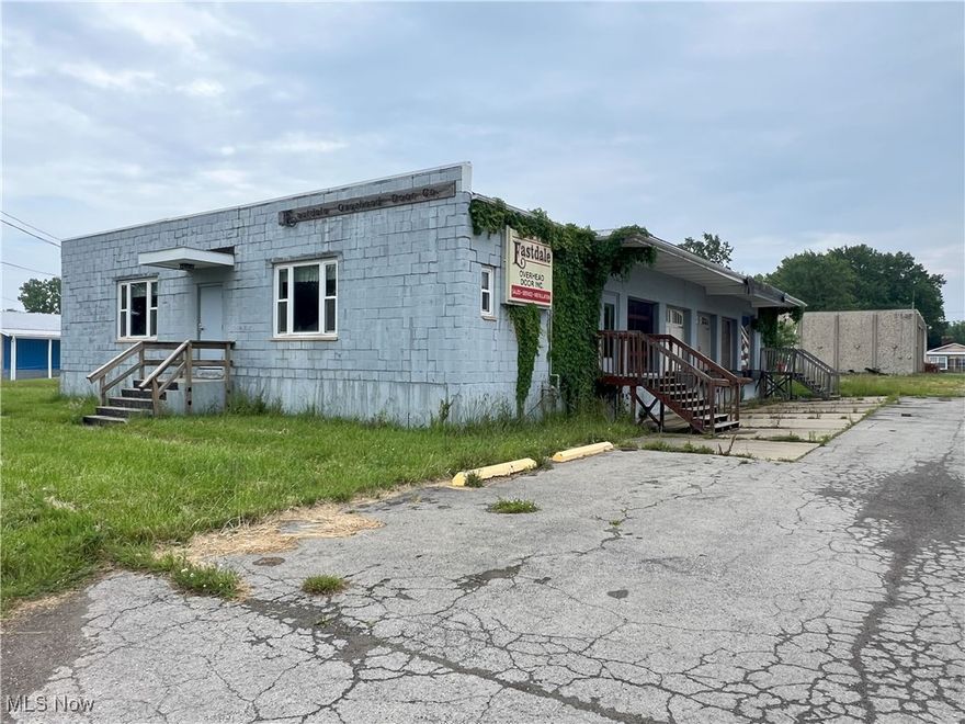 High traffic and high visibility, corner lot, 6,000 square foot block building with 5 loading docks, four with 7 ft high x 8 ft wide doors and one 8 x 8. Zoned "Local Business". Roof in need of repair. 50' x 90' main building and a 30' x 50' addition. Chain link fenced-in area on the east side of the building. 2 offices plus a restroom. Being sold as-is with all contents included. Former garage door company. E-Z access to Rte 11 and I-90. Nearly 1 acre lot, plenty of parking.