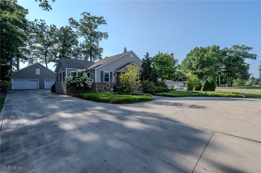 Welcome to 12150 N Boone Rd — a beautifully updated property just minutes from I-71, the airport, and all that Strongsville has to offer.

As you arrive, you’ll notice the meticulously maintained landscaping, an irrigated front lawn, and a wrap-around driveway that provides ample guest parking and easy access.

The driveway leads to a spacious backyard and a massive outbuilding. This outbuilding features a finished half bath, upstairs plumbing (ideal for a potential apartment), a heated garage, full insulation, and steel walls—giving it a fully finished feel, just like the half bath. It offers incredible flexibility as a guest house, workspace, or additional living space. There’s even a peaceful rear overhang, perfect for relaxing evenings or storm watching.

Now, let’s talk about the home itself—completely remodeled with thoughtful additions that create a sprawling space perfect for entertaining. The kitchen features oak cabinets and flows into a large living area with a stunning fireplace that overlooks the back deck and patio—your own private oasis for gatherings or quiet evenings.

The first floor includes a full laundry room and full bathrooms, making it ideal for single-level living. All high-end appliances stay with the home—so there’s no need to worry about replacements.

Toward the side of the home, you'll find the bedrooms and a luxurious master suite, bathed in natural light from skylights. The suite boasts a huge walk-in closet and a spa-like bathroom with his-and-hers sinks, granite countertops, and a tiled shower with a glass door.

Throughout the home, you’ll find an abundance of custom oak and real wood finishes, along with elegant, tailor-made drapery. The craftsmanship and attention to detail are evident in every corner of the property.

Upstairs, you'll find an additional living area—perfect for a home office, guest room, or extra bedroom.
