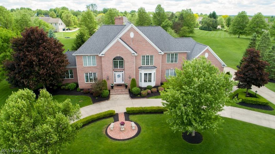 You will appreciate the quality construction and beautiful, all-brick exterior as you approach the circular driveway. This impressive custom home is situated on a quiet cul-de-sac in the pool/tennis community of Chadds Ford. Surrounded by 1.26 acres of impeccably landscaped yard, the expansive paver patio overlooks a park-like setting.  Entering the two story foyer you will notice how this home reflects pride of ownership.  With an open main floor plan, the crisp white trim accents the hardwood floors found throughout.  The formal, oversized dining room has French doors opening to the adjacent entertaining area.  The family room features a stunning fireplace and two stories of windows, bringing natural light throughout the space. The custom kitchen has an adjacent hearth room offering a cozy gathering place by the fireplace. The main floor also includes a sitting room, a private guest bedroom with ensuite bathroom, as well as an impressive paneled office with built-ins and inviting fir