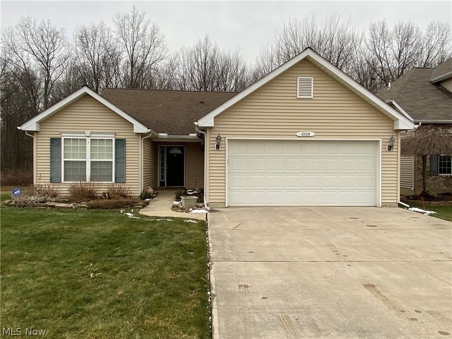 Desirable Ranch located in the Avalon Estates Subdivision. Walk into the long foyer with its vaulted ceilings that leads you to the open concept kitchen, great room and dining area.  Enjoy watching the snow fall through the back patio doors with its picturesque wooded view.  Relax while sitting outside on the deck as you listen to and observe the wildlife.  Back inside you will find the master suite with master bathroom including standup shower, walk-in closet and lots of storage space.  The kitchen boasts light wood cabinets with stainless steel sink and dishwasher, large bar area and is open to the dining room and great room. The spacious laundry room leads you to the 2 car attached garage. Updates include newer hot water tank and dishwasher.  The small storage sheds in the back also stay with the property.