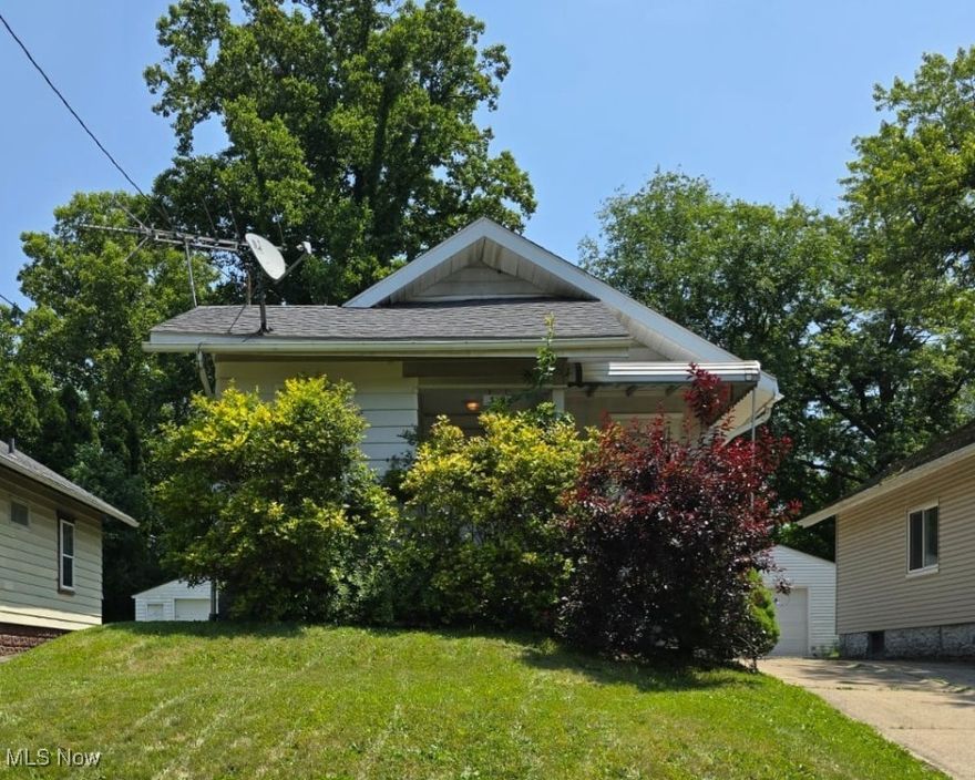 Investor Special in Akron! This 2-bedroom, 1-bathroom home is packed with potential and waiting for your vision. Nestled on a quiet street in Akron, this property features a detached 1-car garage and a manageable yard—perfect for renters or first-time buyers. With some cosmetic updates and TLC, this could be a great flip or long-term rental. Solid bones and a functional layout make this a smart investment in an up-and-coming area. Bring your toolbelt and imagination—opportunity knocks!