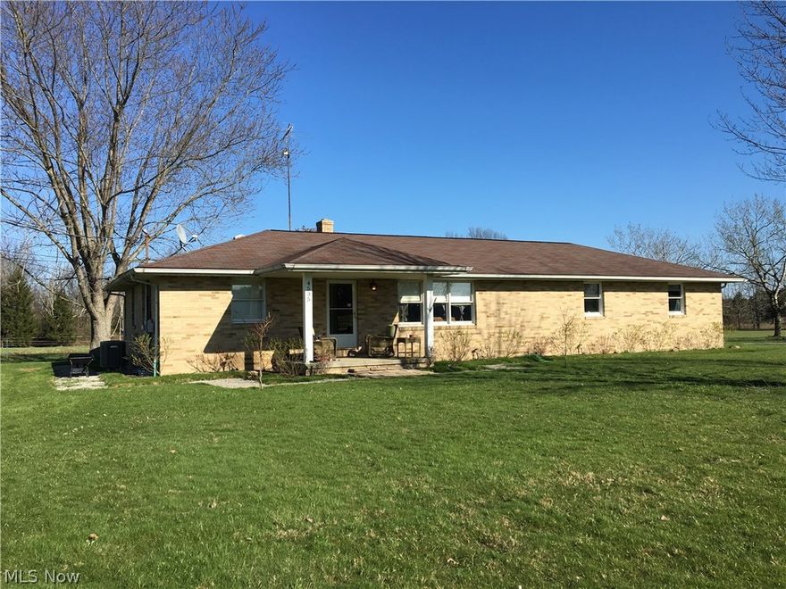 Looking for little bit of country?  Look no further than this beautifully updated 2-3  bedroom all brick ranch situated on just under 1 acre!  Be prepared to fall in love with this home.  Updated kitchen features 18" ceramic tile floor, newer counters and ceramic back splash.  Spacious living room with large picture window and neutral colors.  Updated bath with newer flooring, newer vanity with granite counter.  Master bedroom and 2nd bedroom both have double closets.  3rd bedroom is in the basement, also with a double closet.  Huge  beautifully finished family room in the basement. 10x12 laundry room with huge storage closet. 200 amp electric service. Attached 2.5 car garage.  Great back patio and covered front patio, a great place to watch the sunset! Come get your little piece of the country today!