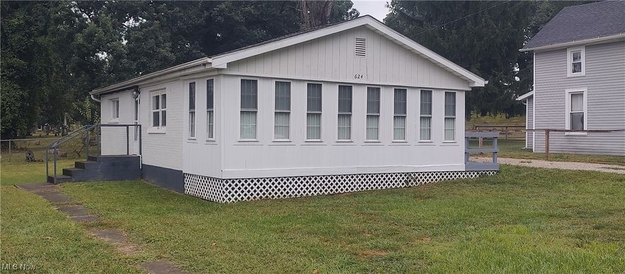 Move right in and enjoy this well-maintained townhome featuring fresh paint, some new flooring for a clean feel and a new mini split providing air conditioning. The newly enclosed porch adds a cozy feel to the house, perfect for morning coffee or entertaining guests. Conveying with the property is a storage shed and appliances making your move easier.