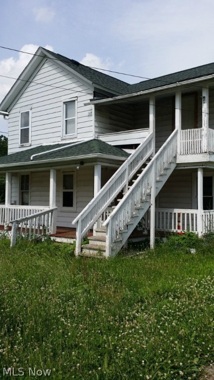 Three parcels of land that include an up and down duplex. A two bay garage zoned for auto sales/repair. Property being "sold as is". Repairs needed and some equipment is included with purchase. Corner lot with great visibility.