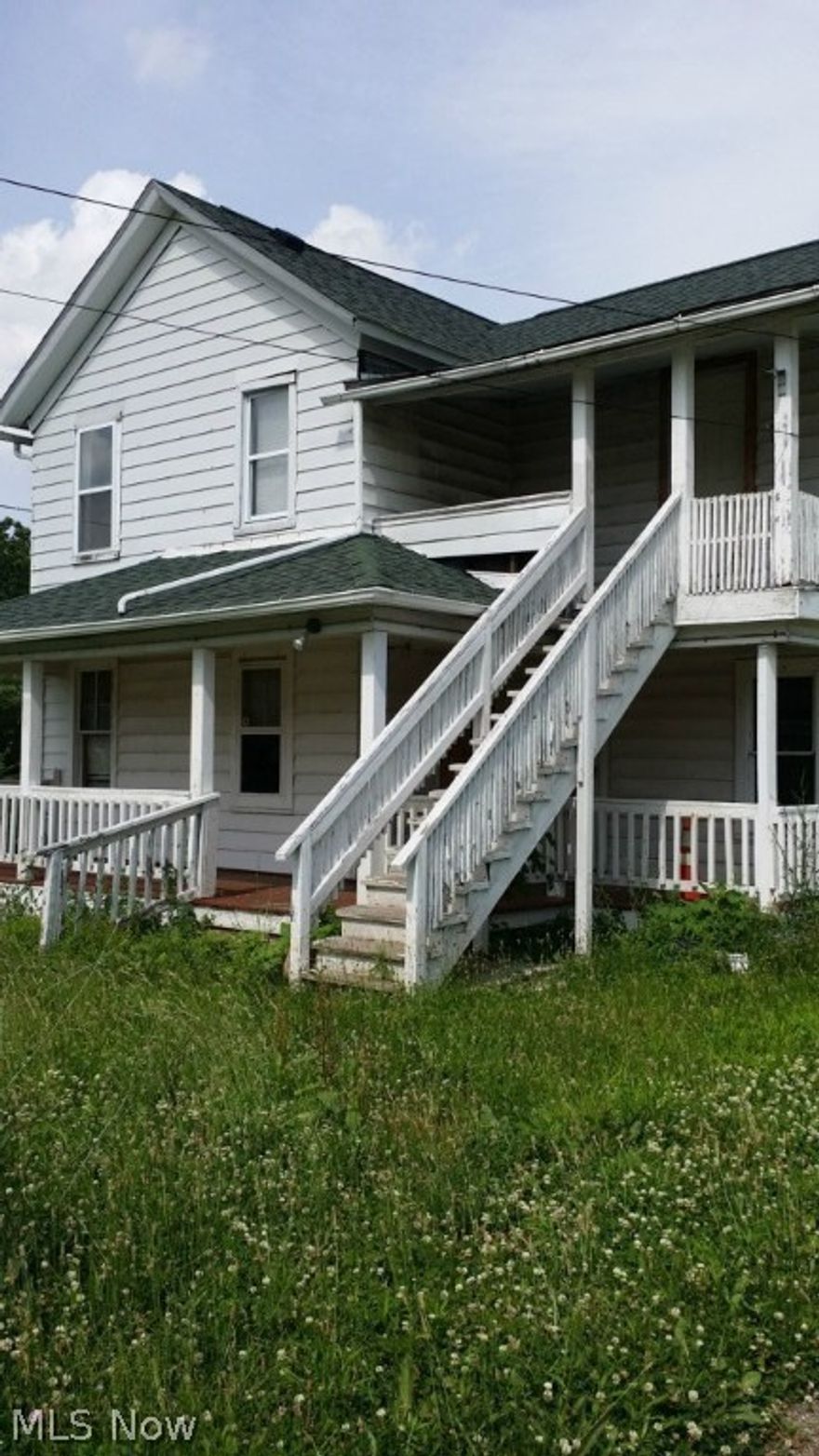 Three parcels of land that include an up and down duplex.  A two bay garage zoned for auto sales/repair.  Property being "sold as is".  Repairs needed and some equipment is included with purchase.  Corner lot with great visibility.
