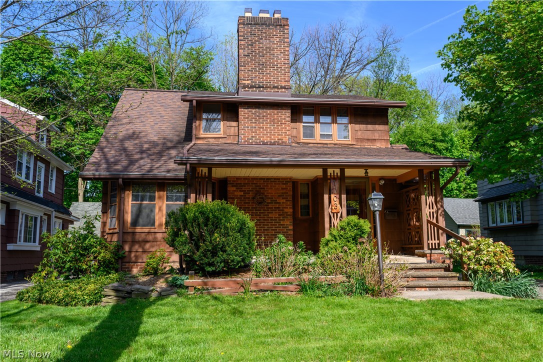 Adorable craftsman style home on quiet tree lined street. The sprawling covered front porch leads you into this charming 3 bedroom, 1.5 bath home. Wood floors throughout the home with tiled fireplace in Living room, formal dining room w/ built in cabinetry, a sunroom/office w/ access to back patio. Enter the large kitchen w/ pantry, plenty of cabinets and a powder room. Upstairs are 3 bedrooms, and a full bath, the owners suite has a decorative fireplace, a big walk in closet and charm throughout, Enjoy the 2nd bedroom balcony patio. Large fenced in back yard w/ 1 car garage. Just the right size back yard w/ perennial gardens. The home comes with a Generic generator. Walk to Coventry, minutes to Little Italy, University Circle and Downtown. Selling "as is". Buyers to assume minor POS violations