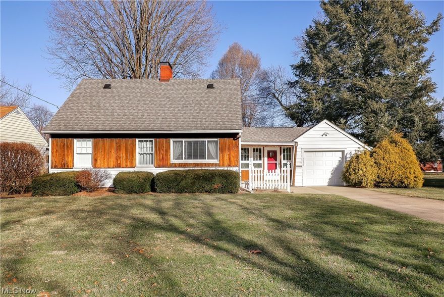 This Charming bungalow in the heart of Perry Township has been well cared for with most major updates complete including newer vinyl and glass block windows. Feel the coziness from the living room with a wood burner that can literally heat the entire house! There is a master bedroom on the first floor.  Upstairs you'll find two additional bedrooms and a full bath. Ready for spring? Enjoy the beautiful sunroom with views of the additional lot  which is included. You'll have plenty of room for outdoor entertaining and parking in the double garage and extra drive! Enjoy extended living space in the basement with beautiful Nature Stone flooring and an additional half bath. All this home needs is your personal touch! Close to shopping, restaurants, and schools and ready to move right in! Book your showing today.