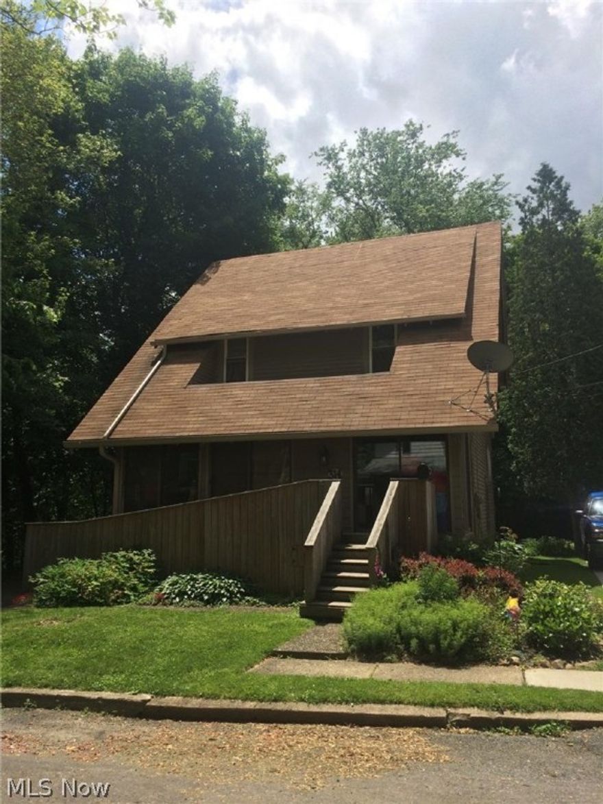 It's in the Address "RIVERSIDE".  Nature Lover's delight in this 3 Bedroom home with all it's charm and character set atop the Cuyahoga River in Kent.  Beautiful scenery to help escape the city life yet five minute walk to downtown, two minute walk to Portage Hike and Bike trail; but why walk when you can set your Canoe or Tube in and float away right outside your door. Hardwood flooring throughout complimented with wide wood trim and arched doorways.  Dishwasher 2 years old, Refrigerator 2015, NEW FURNACE AND CENTRAL AIR  in 2013, Garage roof in 2014, glass block windows in basement.  Enjoy outdoors and moving water right outside back slider on Covered Deck or wonderful Sunroom on front of home.  Attic could be finished to add additional square footage to home.  Come take a look!!