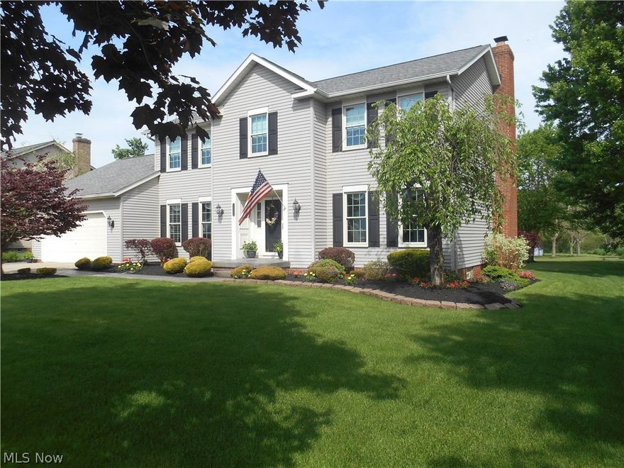 Welcome to 13235 Williamsburg Ave in Lake Township! This stunning home includes many updates and sits on a fantastic .68 acre lot.  Walk into the lovely foyer which is accompanied by the formal dining and living rooms. Wonderful kitchen has newer appliances, a dinette area for meals and walk out sliding door (2008) leading to the wood deck. First floor laundry room, den and family room with gas fireplace as well. The second level offers a Master Suite with a cathedral ceiling, walk-in closet and spacious master bath with double sinks.  Three additional bedrooms plus a full bath complete the second level.  The endless updates include: roof (2008), water heater (2009), sump pump and outside pump (2014), keypad entry to garage (2014), glass block windows, newly painted and carpeted rec room in the lower level, newer paint throughout the home,  stained deck (2014), new service door on garage (2016) and so much more! Williamsburg Village also includes tennis courts and a pond which is great