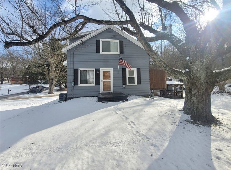 Charming and well-maintained bungalow, situated on an oversized corner lot spanning over 3/4 of an acre.  This 3-bedroom, 2-full bathroom home has been freshly painted throughout, with all carpets professionally cleaned--move-in ready and waiting for you.  Sit back and enjoy your favorite drink on the enclosed back porch.  The home includes a 1-year home warranty, offering added peace of mind for the new owner.

Outside, you'll find exceptional space and versatility.  The impressive 24' x 32' three-car garage features 8' doors, wired for 220, and includes a large tarp divider to separate one bay, ideal for a workshop, storage, or hobby area.  Enjoy outdoor living on the newer spacious deck complete with a tall privacy wall, perfect for relaxing or entertaining.  Additional outdoor features include a 12' gazebo and a 20' x 20' outbuilding, offering endless possibilities for storage, recreation or projects.  

The property is accented by two Golden Delicious apple trees, adding charm and seasonal enjoyment to the beautifully sized yard.

With ample space, privacy, and great amenities both inside and out, this property offers a rare opportunity to enjoy comfortable living with room to grow.  Don't miss it!