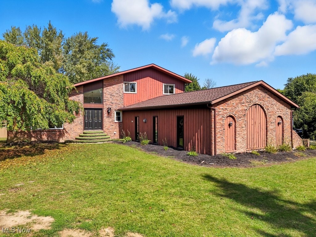 Discover this unique property tucked away on nearly 6 private acres, set 500 feet off the road for unmatched privacy. The home has just been refreshed with numerous updates, including fresh paint, new carpet, LVT flooring, select window replacements, and newer roofs on house, garage and pool house. The residence offers expansive living space along with an attached pool house featuring a in-ground pool with diving board (3–9 ft depth) — perfect for swimming laps or year-round enjoyment.
A long concrete driveway leads to a detached 4-car garage equipped with a car lift, commercial-grade features, and abundant parking. The main home also includes a freshly painted, heated 3-car attached garage. Outdoors, you’ll enjoy a picturesque front pond with a fountain and water lilies. Inside, the updated kitchen shines with newer appliances, double ovens, and granite countertops. The full basement is designed for entertaining, with a built-in bar, custom bookcases, built-in lounge seating, and a newly added full bathroom — ideal for movie nights and gatherings. This property truly has it all — space, privacy, and amenities rarely found together. Don’t miss the chance to see it in person! City water available at the street.